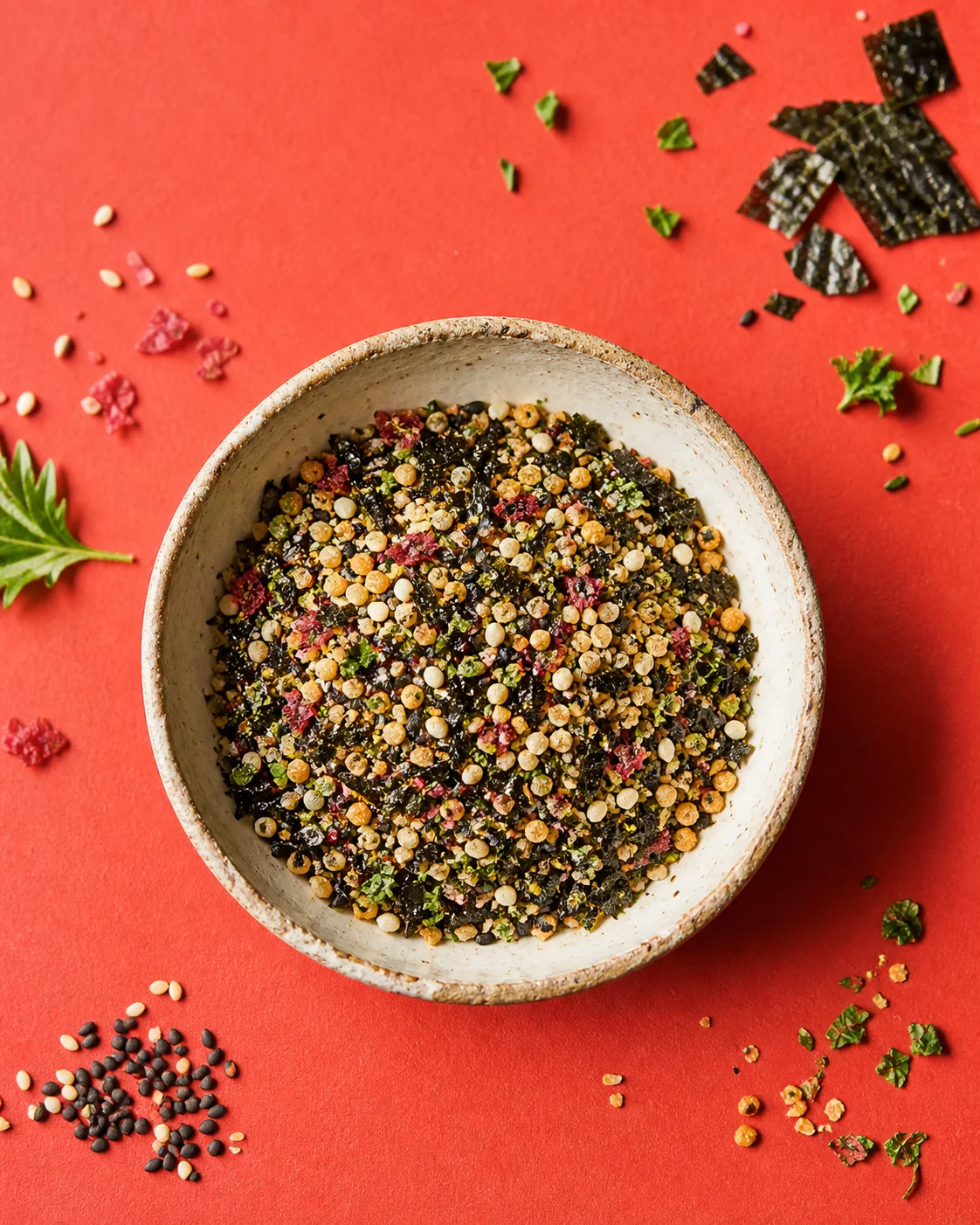 A colorful furikake blend in a ceramic bowl
